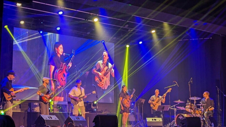 adult students performing at live concert