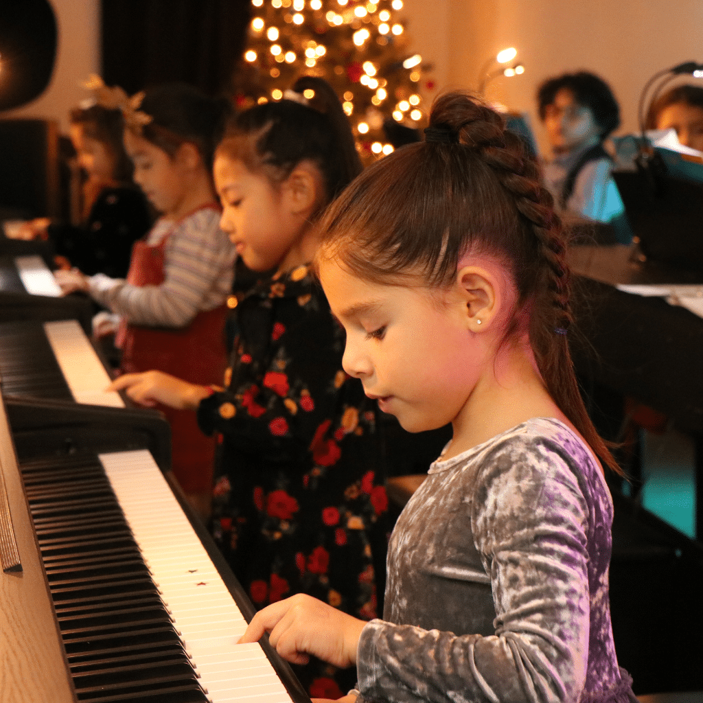 Young students pracvticing piano