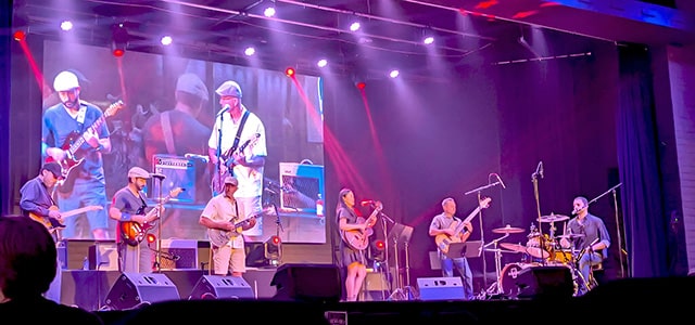 Musicians playing on stage during a live concert